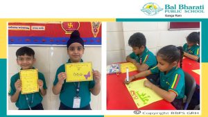 Bal Bharati Public School students engage in the 'गुरुवे नमः' activity, creatively showcasing 'गुरु' in diverse Indian regional languages, celebrating cultural richness.