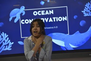 a student is potraying the environmental issue through drama