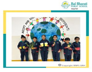 children showing the emoji planters in a group photo